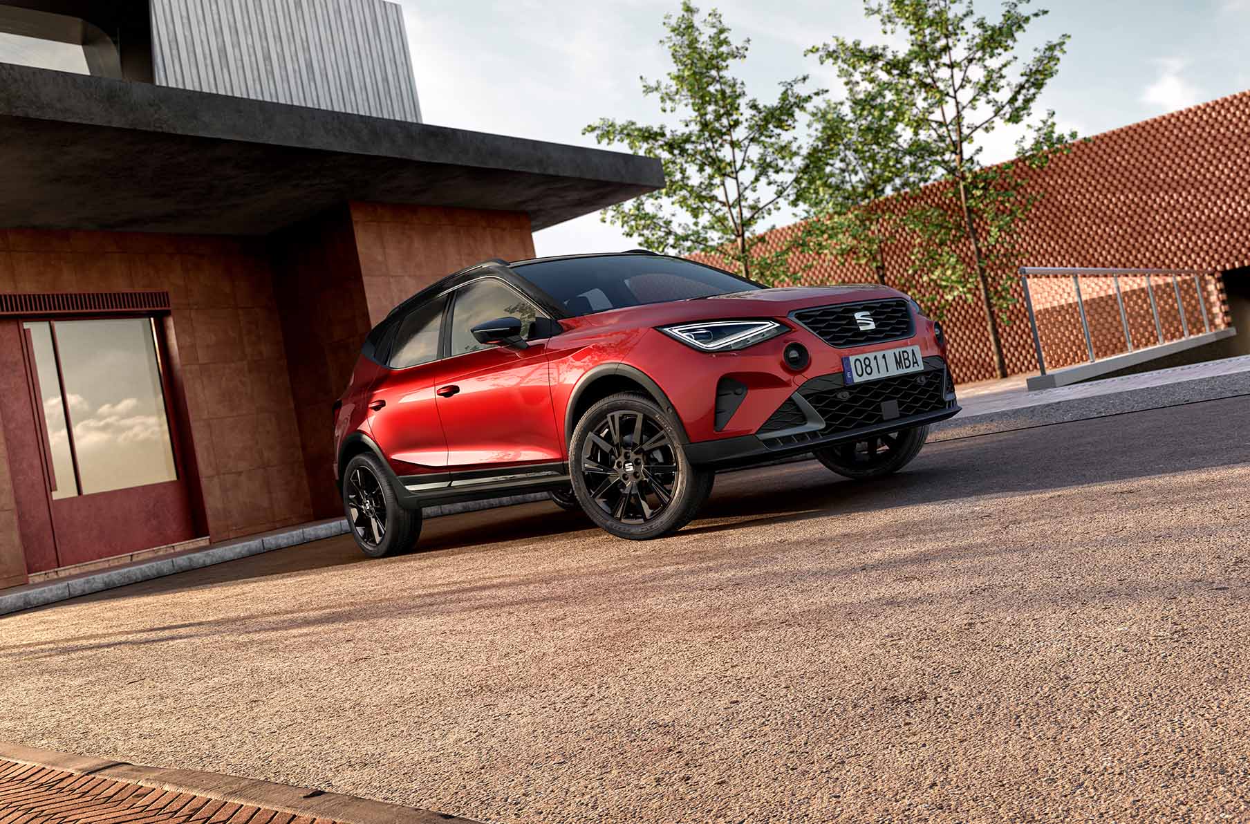 new seat arona black edition in desire red, showcasing 18 inch black cosmo wheels, black side skirts, black roof rails and grey air vents.