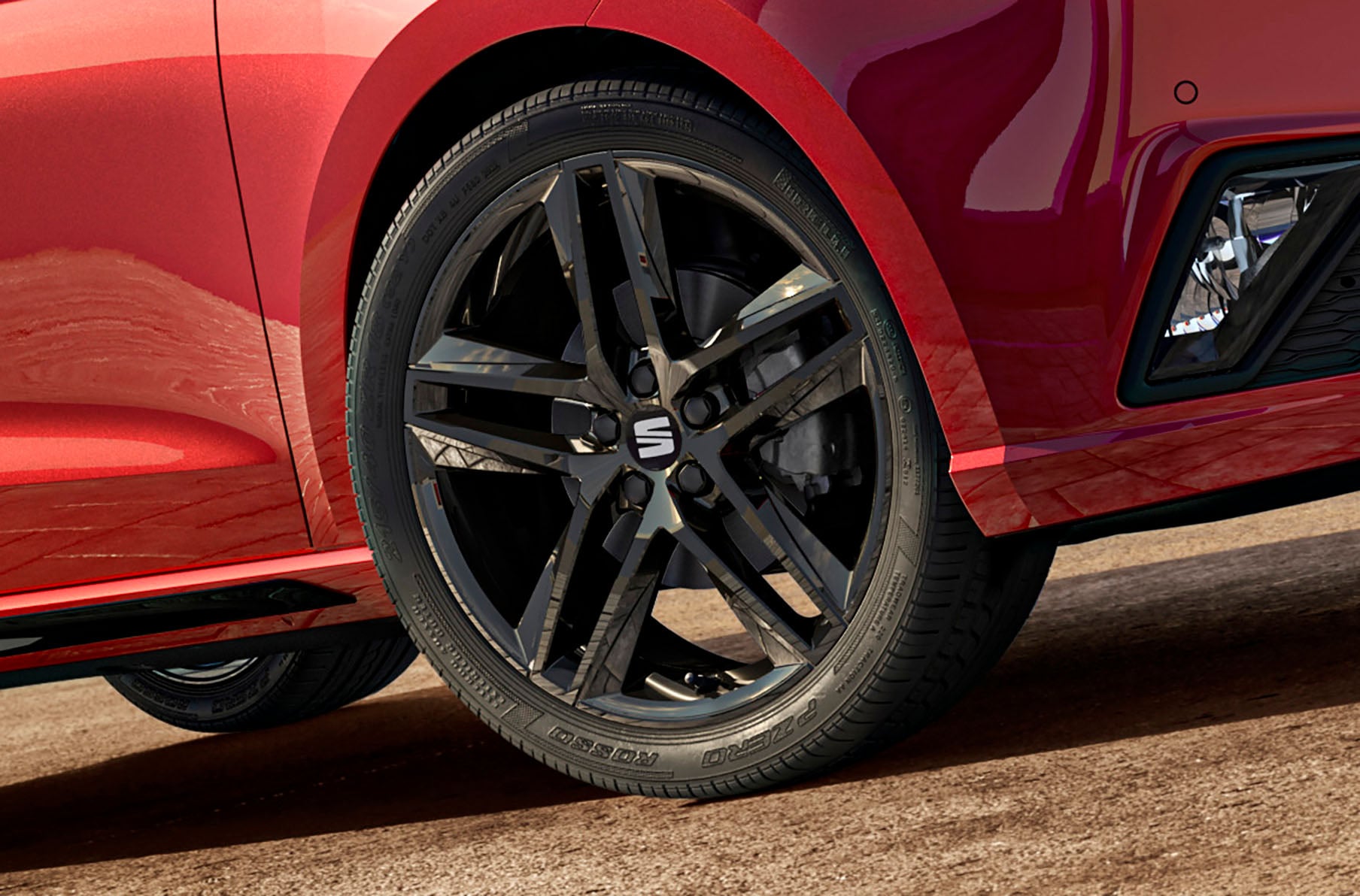 Seat ibiza fr black alloy wheel for black edition car in desire red, close up shot of tyre.